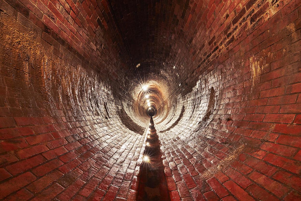 Inside large underground utility tunnel 
