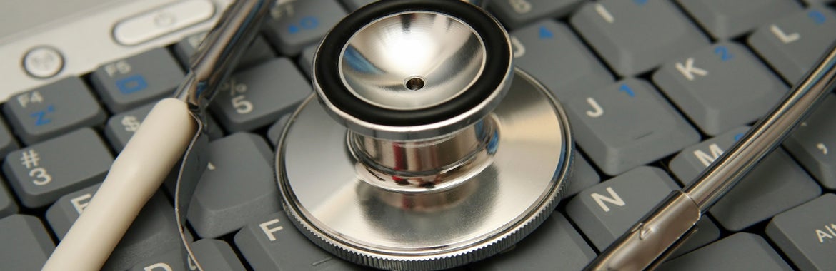 stethoscope placed on computer keyboard