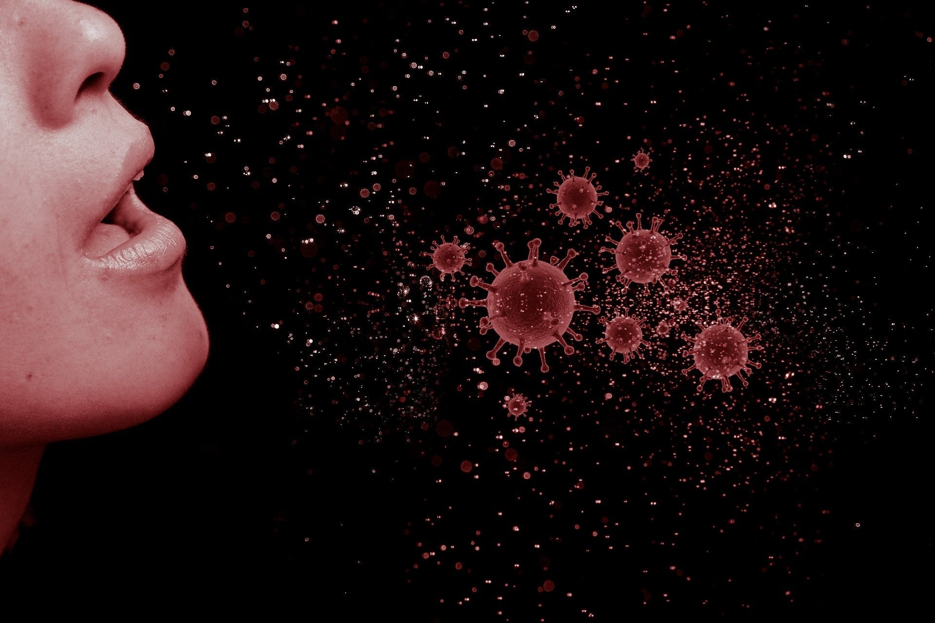 Person coughing with illustration of virus moving through the air