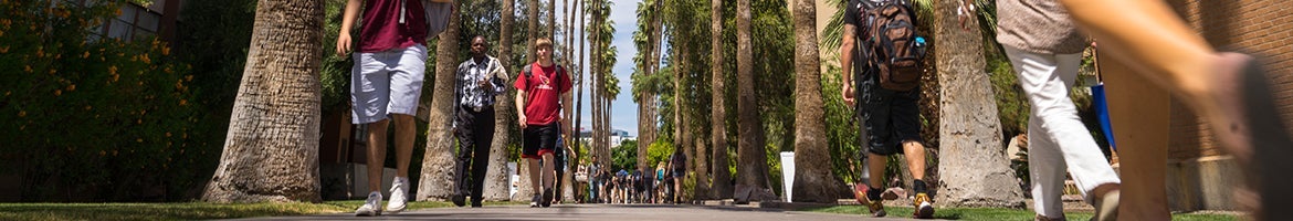 A view from foot level of students walking on Tempe campus