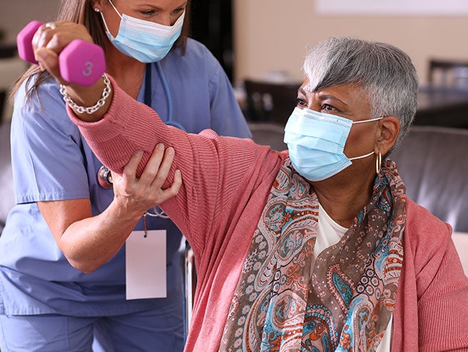 Nurse helping elderly patient